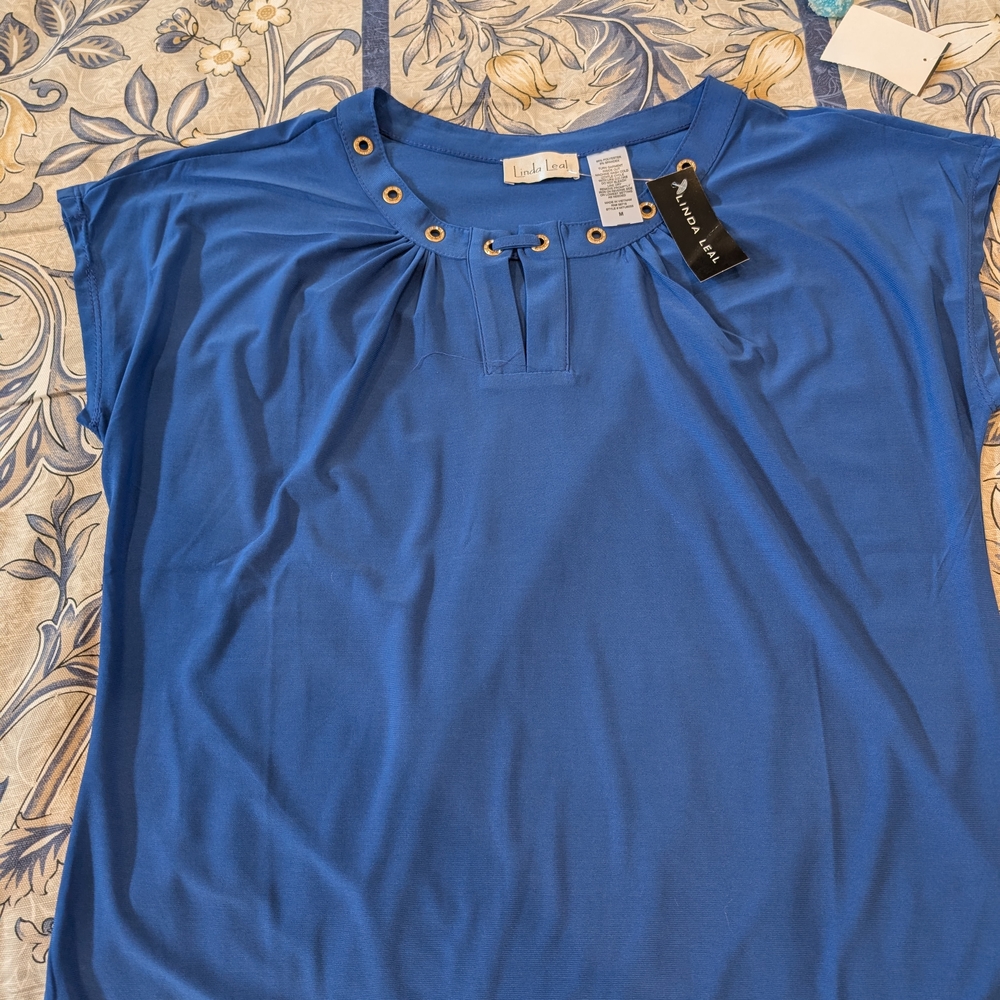Linda Leal                   Women's Blue Top